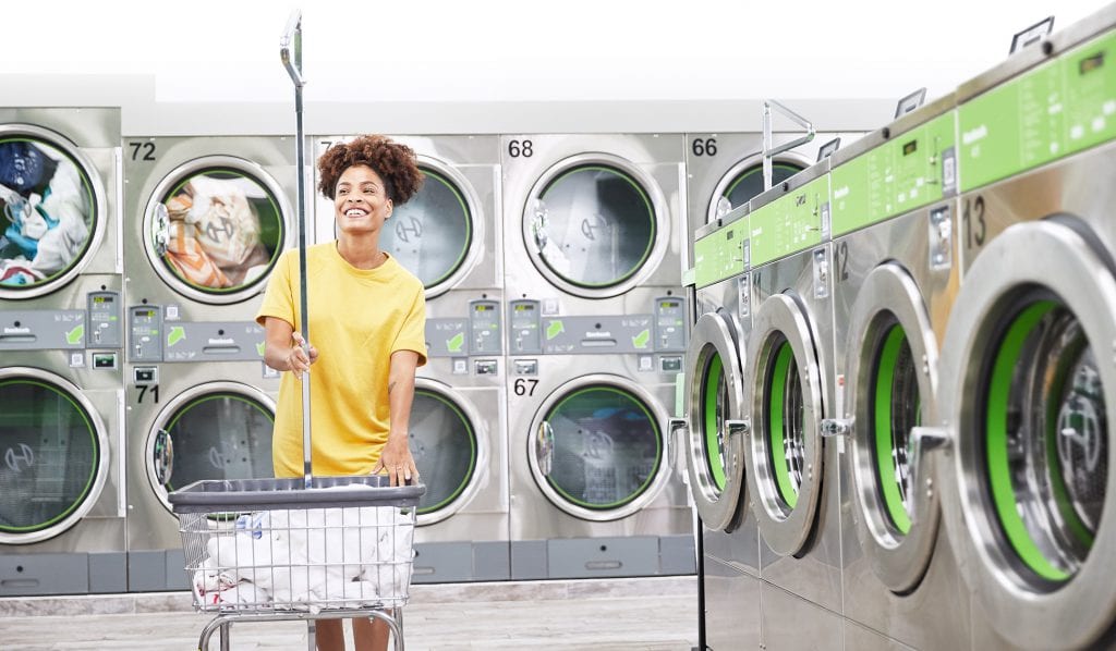 Illustration: woman using a laundromat - About the success of laundromat investment