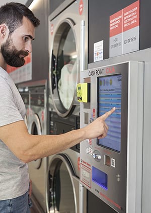 Payment system for laundromat owners - central pay